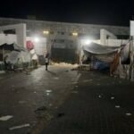 Raise your hands’: Israel raids hospital in centre of Gaza war