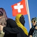 Swiss controversial ban on public  use of facial coverings takes effect from January