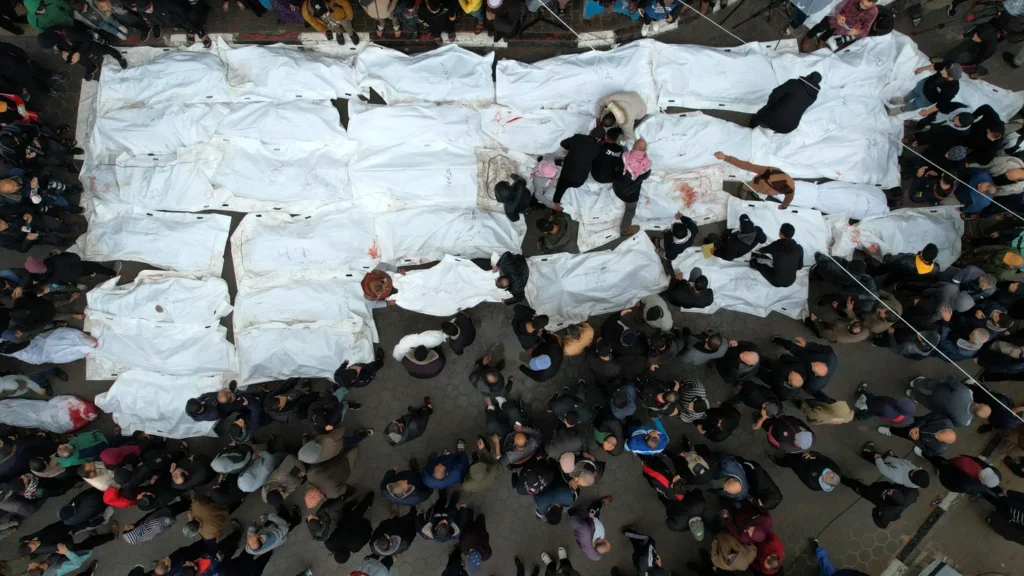 palestine-gaza-mourners-attend-funeral-civilians-killed-maghazi-refugee-camp-25-dec-2023-afp.jpg